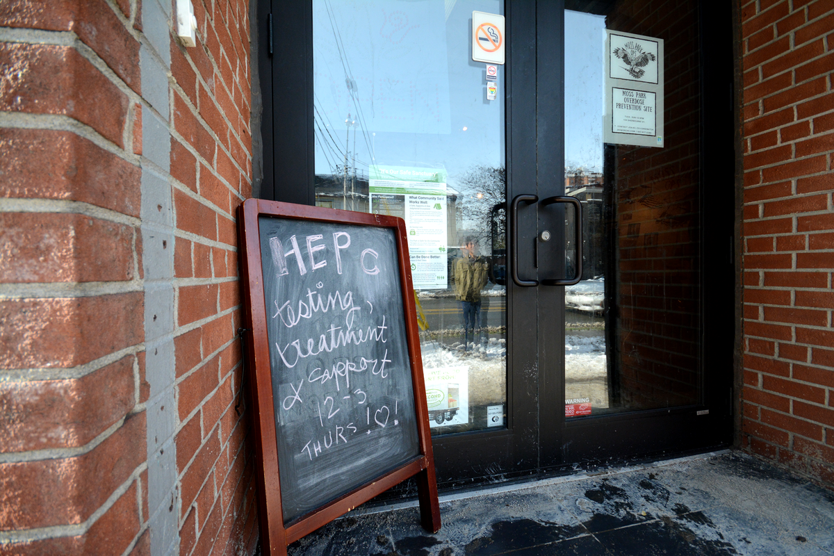 The front entrance of Moss Park CTS with a sign for the hepatitis C program.