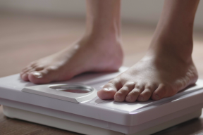 CATIENews Aug 16 2022 feet on a bathroom scale